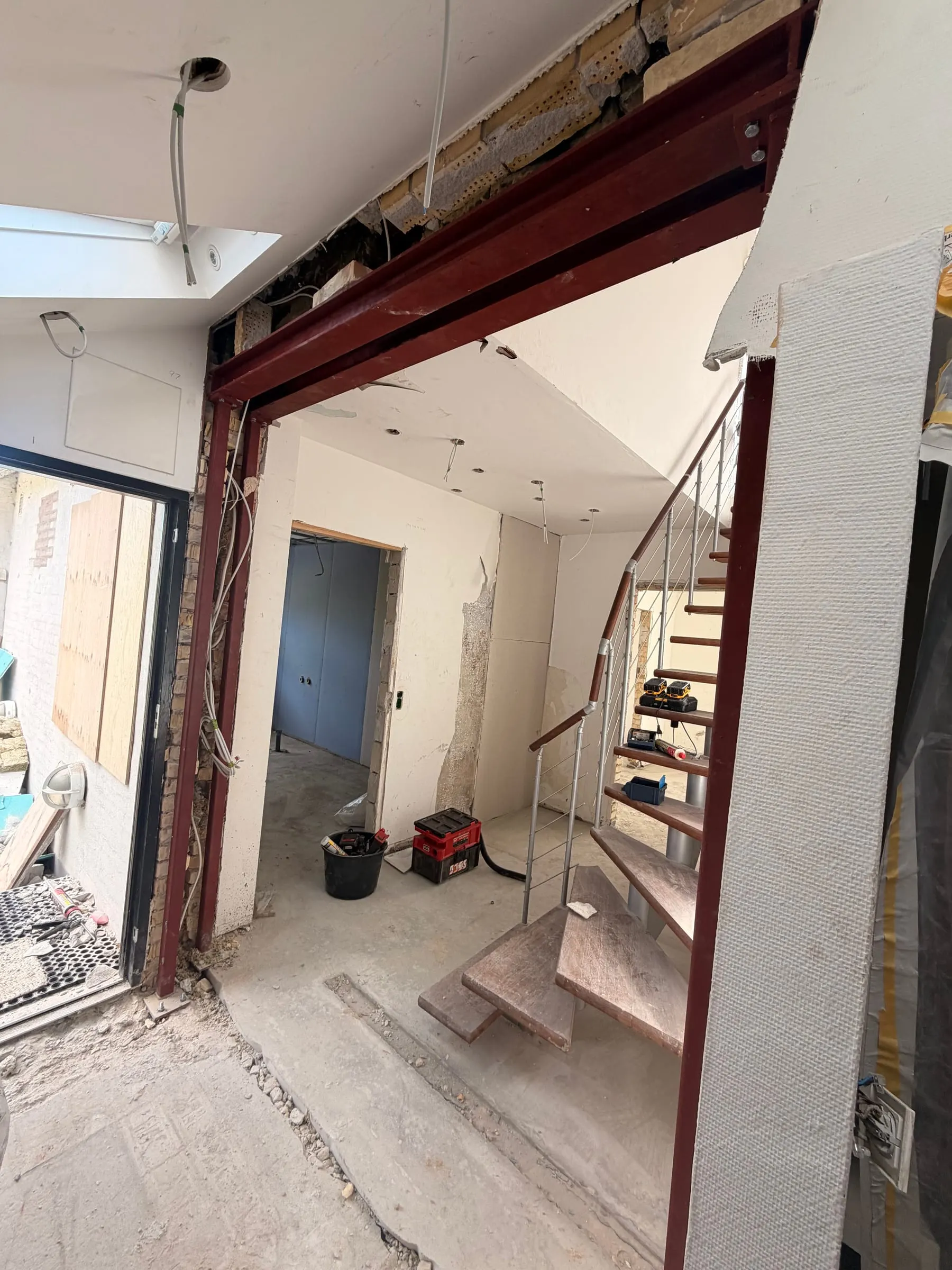 Steel frame by the stairs after removing a load-bearing wall